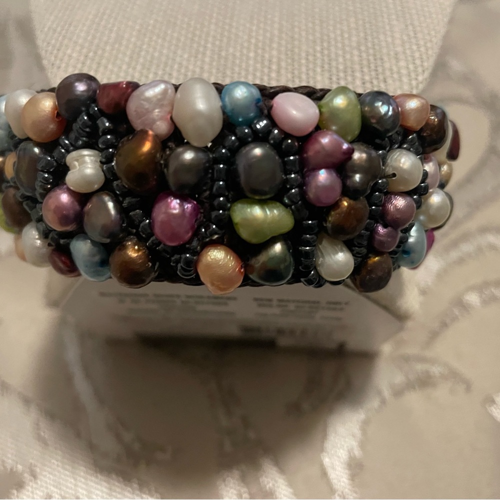 Handcrafted cuff bracelet with multi colored pearl-like beads